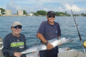 Jeff Hartjoy of Sailors Run and Chuck Gauthier pose with the wahoo they caught on Wasabi. Photo: Karen Earnshaw 