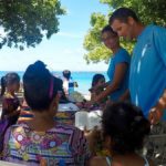 Cruisers provide glasses to people on Likiep Atoll.